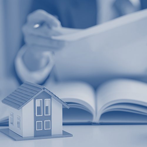 Lawyer consulting clients about the house purchase contract